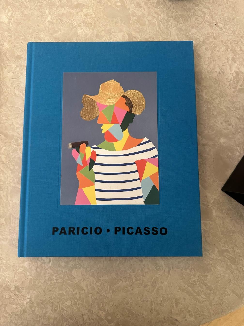Book with a Picasso-style portrait on the cover